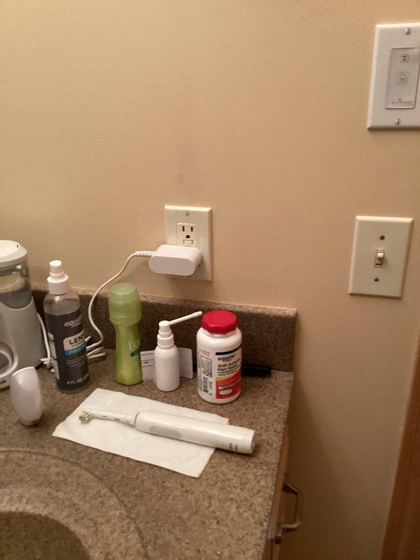 Completed final room-by-room evaluation for FRM electrical inspection, noting code compliance issues with bathroom and living room fixtures. Identified requirement for GFCI protection for washer and documented electrical outlet placement in bathroom near water sources. Provided comprehensive estimate for necessary electrical upgrades to bring property into full compliance with current electrical code requirements.