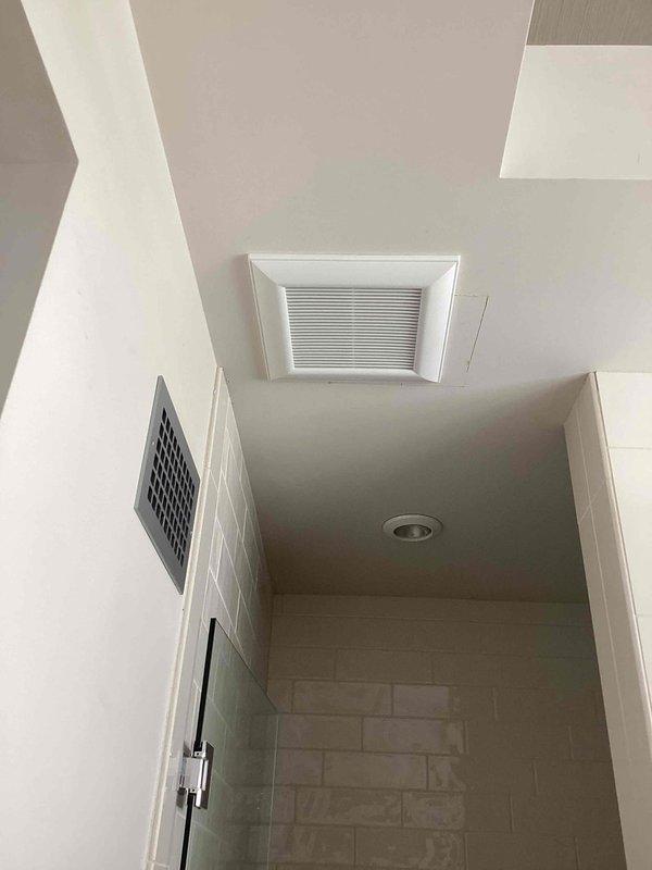 Installed new wiring for previously unconnected bathroom exhaust fan, connecting it to the existing bathroom lighting circuit and adding a dedicated switch for independent operation. Work required attic access to complete proper electrical connections between the ceiling-mounted fan unit and the new wall switch.