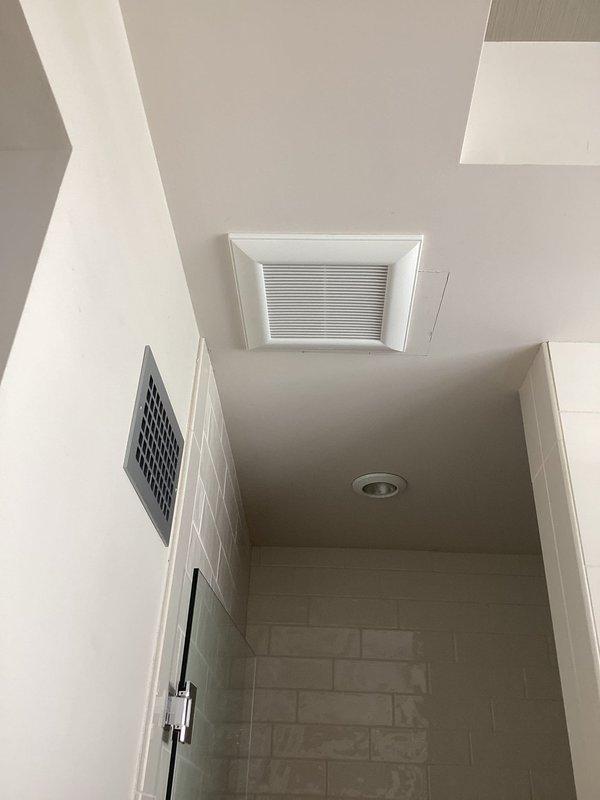 Installed new wiring for previously unconnected bathroom exhaust fan, connecting it to the existing bathroom lighting circuit and adding a dedicated switch for independent operation. Work required attic access to complete proper electrical connections between the ceiling-mounted fan unit and the new wall switch.