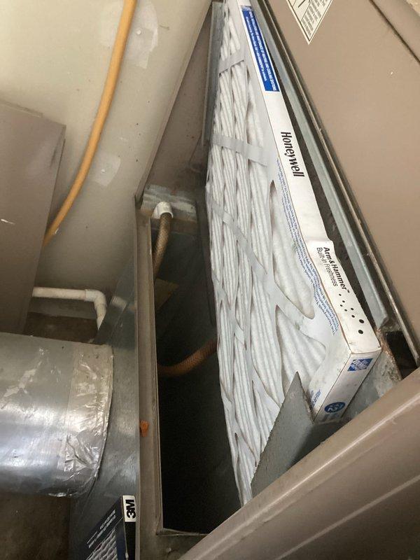 Performed scheduled maintenance on residential HVAC system with 8-12 arrival window. Inspected exterior condenser unit and interior components including Honeywell air filter, which was found clean and properly installed. All systems functioning normally; completed general maintenance with no issues identified.