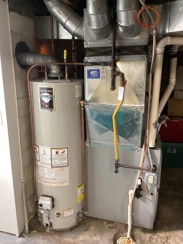 Completed FRM electrical inspection revealing two code compliance issues: non-functional ballast in basement fluorescent fixture and laundry area requiring GFCI protection. Provided estimates for necessary repairs and documented conditions with photographs of mechanical room equipment and unfinished garage/storage area.