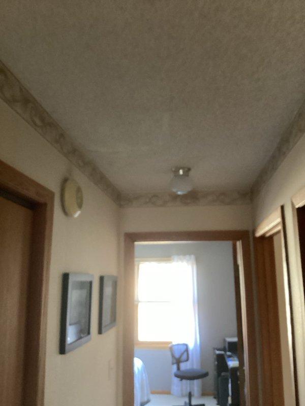 # Electrical Service - Inspection Summary

Completed FRM (Final Residential Mechanical) electrical inspection at residential property. Identified three code compliance deficiencies requiring correction: absence of hardwired interconnected smoke alarm system per current electrical code requirements, washing machine receptacle outlet lacking required GFCI protection, and water supply system not properly bonded to electrical grounding system. Documented all deficiencies with photographic evidence showing existing battery-operated smoke detectors and overall electrical infrastructure. Provided detailed estimates for remediation work to bring property into full code compliance and completed inspection report for permitting authority.