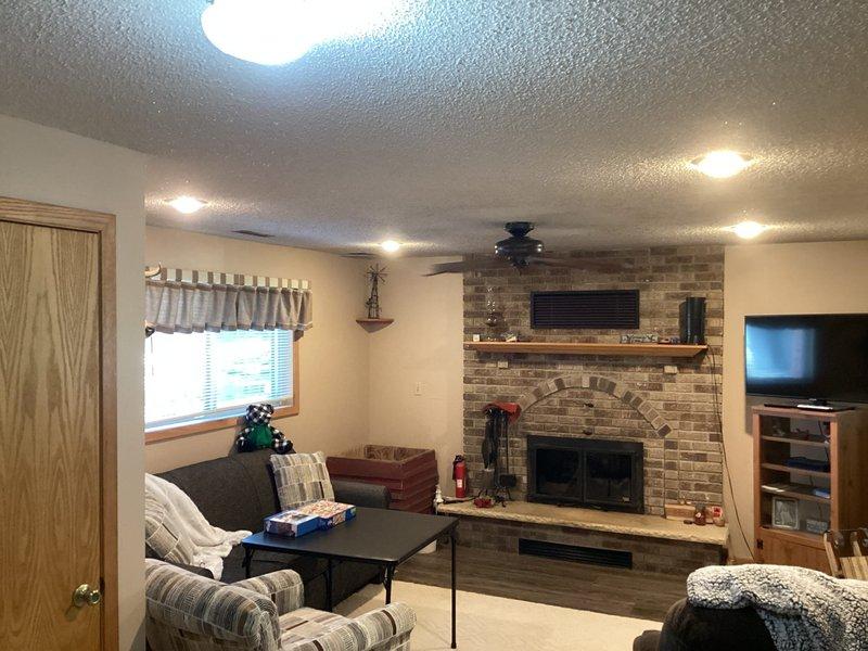 # Electrical Service - Inspection Summary

Completed FRM (Final Residential Mechanical) electrical inspection at residential property. Identified two code compliance issues requiring correction: absence of GFCI protection at clothes washer receptacle in utility room and defective GFCI outlet in main floor bathroom requiring replacement. Documented deficiencies with photographic evidence showing existing bathroom GFCI outlet and overall property conditions. Provided detailed estimates to homeowner for necessary corrections to meet electrical code requirements and pass final inspection.