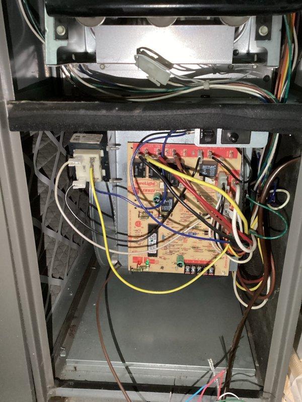 # Service Report: No Heat Call - Control Board Failure

Responded to a no-heat service call on a residential furnace system less than 10 years old. Upon arrival, performed diagnostic evaluation to determine cause of heating failure. Initial assessment indicated potential igniter malfunction; however, further testing revealed failed control board as the root cause of system inoperability.

Removed access panel and inspected internal electrical components and control circuitry. Verified control board failure through visual inspection and electrical testing. The main circuit board showed signs of component failure preventing proper system operation and ignition sequence. All wire connections, gas valve assembly, inducer motor, and associated safety controls were inspected during diagnostic process.

Documented equipment condition through photographs showing control board assembly, wiring connections, and internal furnace components including inducer blower assembly and gas manifold. Prese