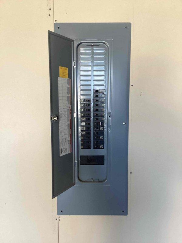 Arrived on-site to provide estimate for Tesla electric vehicle charger installation. Performed assessment of existing electrical panel to determine capacity and feasibility for EV charger circuit addition. Documented panel configuration with photographs showing available breaker spaces and current electrical distribution setup. Provided customer with detailed estimate for charger installation work.