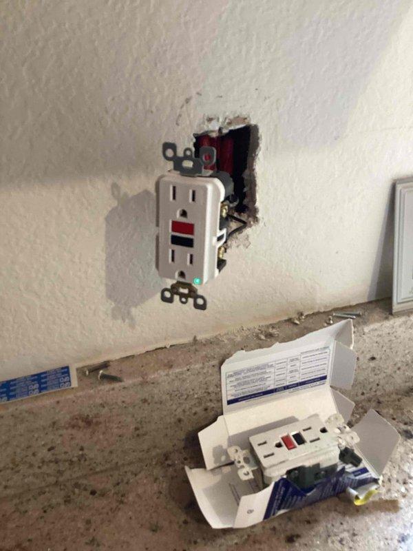 Responded to service call for six non-functioning kitchen outlets. Upon arrival, verified that circuit breakers were not tripped. Diagnosed issue as improperly wired GFCI receptacle that had been previously installed incorrectly with reversed line and load connections. Removed existing GFCI outlet, corrected wiring configuration to proper specifications, and reinstalled device. Tested GFCI functionality using test and reset buttons to confirm proper operation. Verified all six downstream kitchen outlets restored to full functionality. System operating correctly upon completion.
