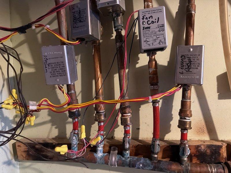 Responded to no heat call and found 20-year-old boiler system (installed May 2006) with failed heat exchanger and non-operational indirect tank pump, resulting in complete loss of flame and heating capability. Conducted thorough diagnostic assessment of the multi-zone heating system including inspection of zone valves, copper piping network, expansion tank, and boiler internal components. Documented system condition with photos and provided customer with repair and replacement estimates for failed equipment.