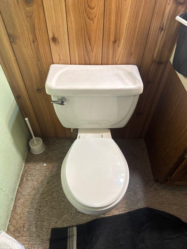 Responded to service call for toilet with missing internal tank components. Upon arrival, found flush handle broken and internal flush mechanism parts absent from tank. Replaced defective flush handle with new chrome lever assembly to restore proper flushing operation.