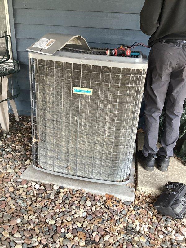 Completed preventive maintenance agreement service on residential air conditioning system. Performed comprehensive inspection of outdoor condenser unit, which showed signs of age with visible dirt accumulation and weathering on metal grille panels. Conducted diagnostic testing using digital meters to assess system performance and operational parameters. Unit is older and showing wear; documented current condition with photos and prepared estimate for recommended repairs or replacement options for customer consideration.