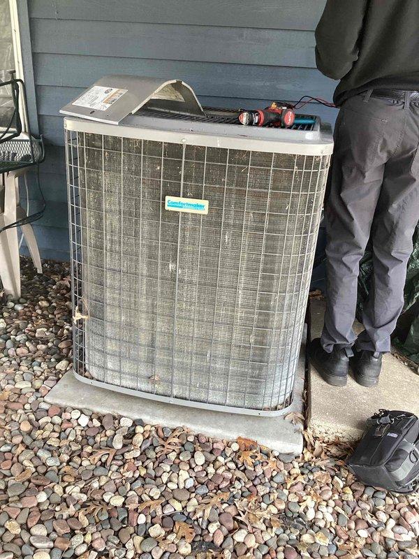 Completed preventive maintenance agreement service on residential air conditioning system. Performed comprehensive inspection of outdoor condenser unit, which showed signs of age with visible dirt accumulation and weathering on metal grille panels. Conducted diagnostic testing using digital meters to assess system performance and operational parameters. Unit is older and showing wear; documented current condition with photos and prepared estimate for recommended repairs or replacement options for customer consideration.