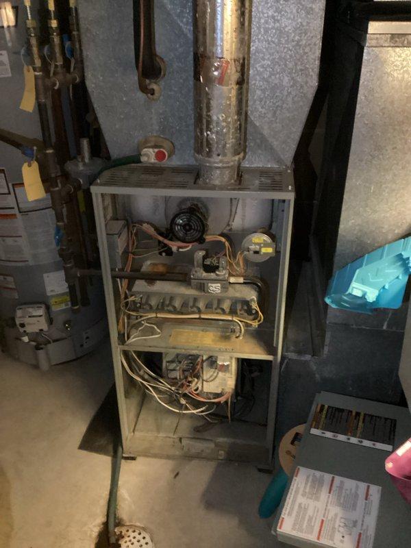 Responded to no-heat call with reported loud buzzing noise and burnt plastic smell from furnace. Upon inspection, diagnosed failed blower motor as cause of heating system failure and unusual sounds. Provided detailed repair estimate to restore heating functionality.