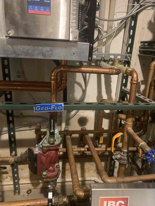 Responded to service call for non-operational in-floor geothermal heating system. Upon arrival, performed diagnostic inspection of the Geo-Flo geothermal heat pump and associated copper piping distribution network. Examined system components including circulation pumps, zone valves, manifold connections, and control unit to identify cause of system failure and restored system to proper operating condition.