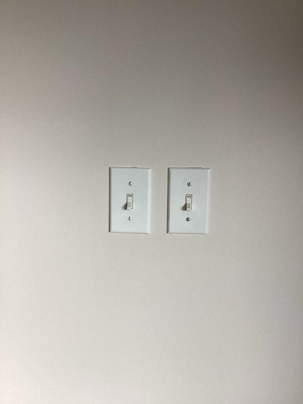 Relocated electrical outlet above fireplace and installed dimmer switch in dining room per previously approved scope. Located existing wire in panel that ran to fireplace location, eliminating the need for drywall removal. Ran new wiring from TV outlet box to fireplace, installed bypass switch to ensure constant power supply, and completed all connections to code.