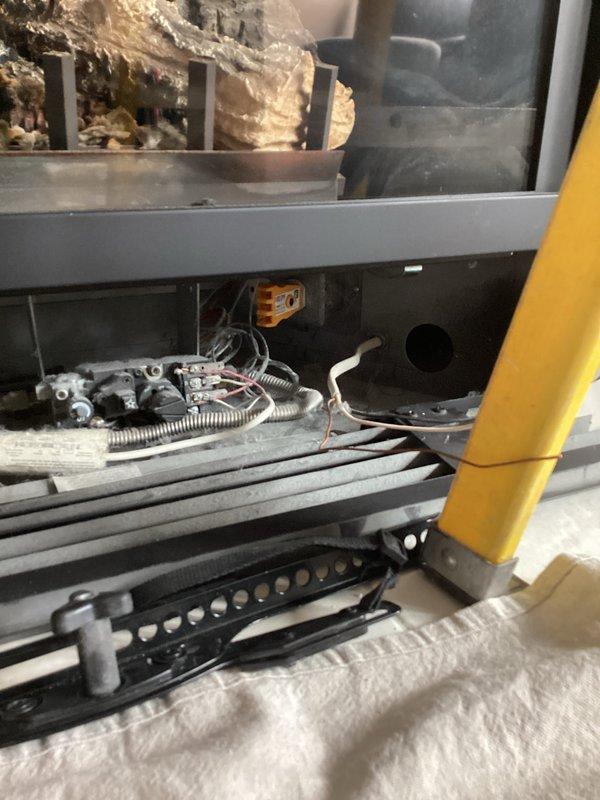 Relocated electrical outlet above fireplace and installed dimmer switch in dining room per previously approved scope. Located existing wire in panel that ran to fireplace location, eliminating the need for drywall removal. Ran new wiring from TV outlet box to fireplace, installed bypass switch to ensure constant power supply, and completed all connections to code.