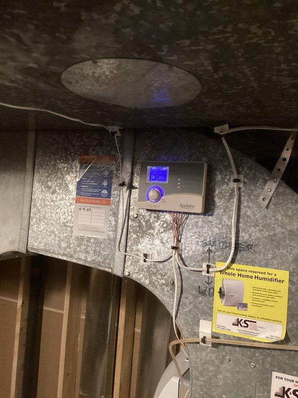 Responded to service call for reported furnace water leak. Upon arrival, inspected HVAC system and Aprilaire whole-home humidifier installation. Conducted thorough examination of humidifier unit, mounting, water supply lines, and drain connections. Verified all connections and components for signs of active leaking or moisture accumulation. Confirmed humidifier was functioning properly with no active leaks detected at time of inspection.