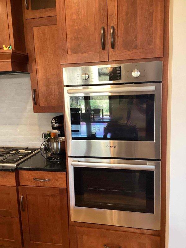 Responded to service call for non-functioning Bosch wall oven that had tripped its circuit breaker. Upon arrival, diagnosed a faulty breaker that would not reset to the on position. Replaced the defective breaker with a new unit in the electrical panel, restoring power to the oven. Additionally capped off the hot tub power line as requested by the homeowner. Verified proper operation of the oven and tested the new breaker installation to ensure safe, reliable performance.