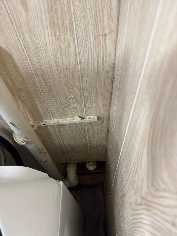 Responded to drainage backup affecting kitchen sink and washing machine caused by broken 2-inch cast iron drain line. Performed video camera inspection of the line to assess extent of damage and document deteriorated pipe condition. Photographed affected plumbing areas in basement showing compromised drainage system and documented findings for estimate preparation, as line requires replacement due to risk of further deterioration.