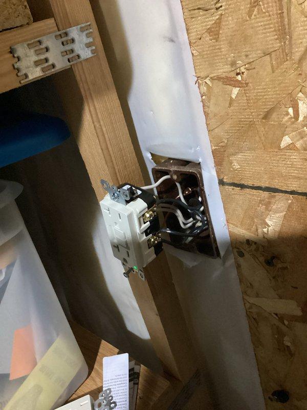 Responded to power outage affecting multiple areas including garage, basement storage room, and mudroom. Upon investigation, identified GFCI outlet wired with reversed polarity and refrigerator in garage creating direct short circuit. Corrected GFCI wiring to proper configuration and disconnected refrigerator to eliminate short. Verified proper operation of all affected outlets and restored power to impacted areas.