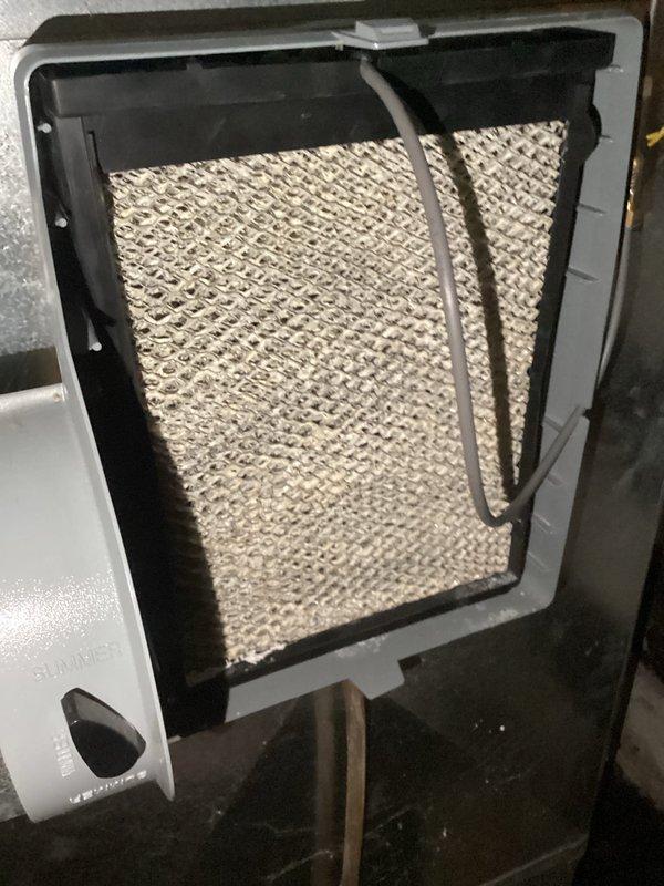 Performed comprehensive tune-up on 25-year-old furnace system that had never received prior maintenance service. Cleaned heavily soiled blower wheel and replaced deteriorated humidifier pad to restore proper system operation and airflow efficiency. Inspected evaporator coil, air filter, and all accessible components to ensure optimal performance.