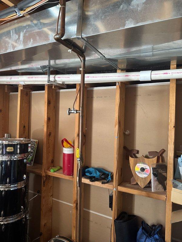 Responded to service call for refrigerator water line shut-off valve installation. Customer had new refrigerator delivered that required a dedicated shut-off valve within 3 feet of the appliance connection point. Successfully installed shut-off valve in basement utility area near water heater to meet manufacturer specifications and provide proper water supply control for the refrigerator ice maker and water dispenser.