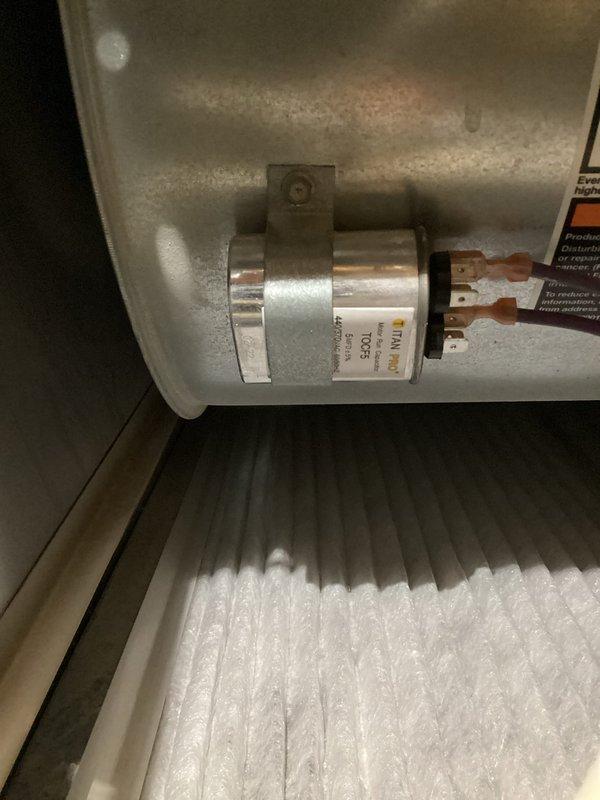 Responded to no heat call on 10+ year old furnace system. Upon inspection, identified dirty flame sensor preventing ignition cycle and failing capacitor with low microfarad reading. Cleaned flame sensor to restore proper flame detection and replaced defective capacitor. Tested system operation and confirmed unit cycling properly with normal heating function restored.