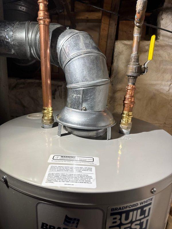 Responded to service call for non-functioning water heater with failed gas valve. Upon assessment, determined repair was not viable and proceeded with complete replacement of unit. Successfully installed new 40-gallon Bradford White standard vent gas water heater, including proper connection of copper water supply lines with corrugated flexible connectors, gas line with shutoff valve, and draft hood for exhaust venting. All connections tested and verified operational upon completion.