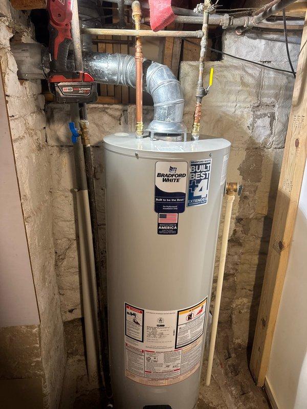 Responded to service call for non-functioning water heater with failed gas valve. Upon assessment, determined repair was not viable and proceeded with complete replacement of unit. Successfully installed new 40-gallon Bradford White standard vent gas water heater, including proper connection of copper water supply lines with corrugated flexible connectors, gas line with shutoff valve, and draft hood for exhaust venting. All connections tested and verified operational upon completion.