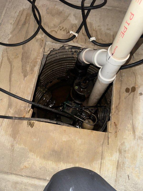 Responded to service call for non-operational sump pump system. Upon arrival and inspection, diagnosed primary pump failure to engage due to stuck float mechanism. Freed float assembly, restoring proper pump operation and automatic water level control functionality.