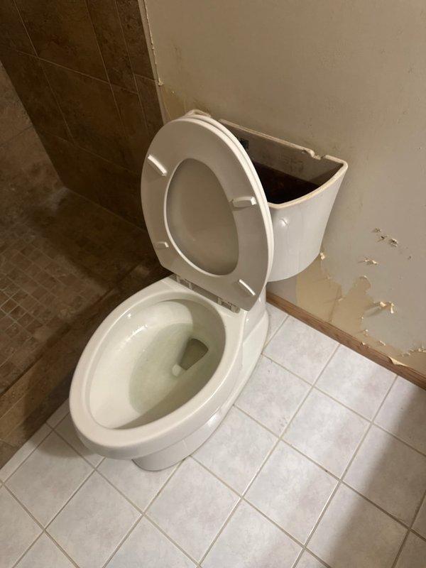 Responded to service call for toilet that was activating randomly and experiencing tank leakage. Upon inspection, identified incorrect gasket installed on fill valve assembly. Performed minor rebuild of toilet tank components, replacing faulty gasket with proper specification part to ensure correct seal and prevent phantom flushing. Tested system operation to verify repair eliminated random activation and resolved leak issue.