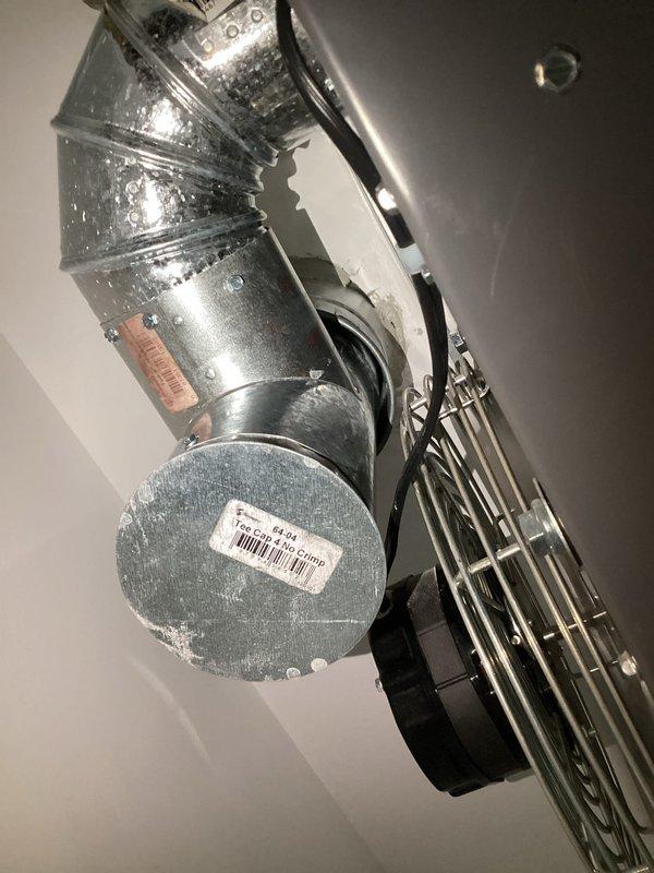 Responded to service call for garage heater with reported water leakage. Upon inspection, identified water infiltration occurring at the exhaust vent penetration point through the roof. Observed active water dripping from the exhaust exit location and confirmed moisture accumulation on the roof surface. Extensive condensation was visible on the exhaust ductwork and surrounding components. Due to wet roof conditions preventing immediate repairs, diagnostic assessment was completed and documented with photographs. Follow-up visit will be required to address the roof penetration seal and complete necessary waterproofing repairs once conditions permit safe roof access.