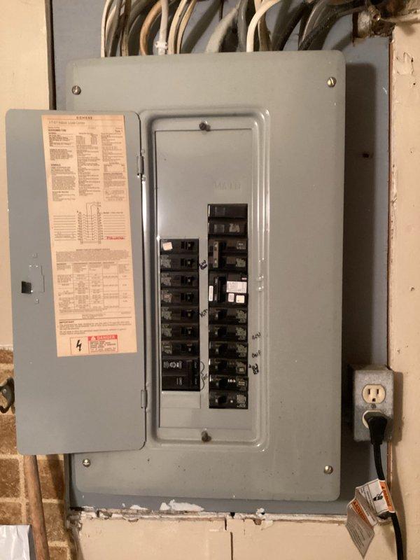 Returned to site per inspector's request to install GFCI protection for stove circuit. Successfully installed GFCI breaker in main electrical panel to provide required ground fault protection for kitchen appliance. Documented completed installation with photographs and submitted to inspector for approval.