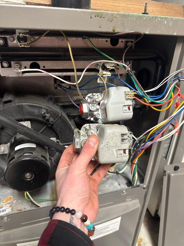 Responded to no heat call on Lennox furnace system that was blowing cold air only. Upon inspection, found air filter in poor condition and diagnosed a failed gas valve preventing proper furnace operation. Replaced gas valve with OEM part and restored heating functionality to the system.