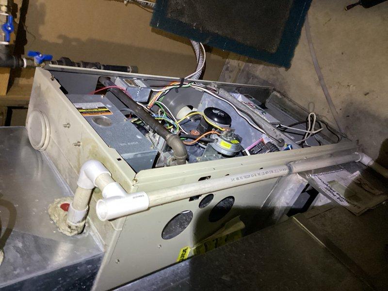 Responded to no heat call on residential furnace system. Upon inspection, identified heavily soiled air filter with significant dust accumulation restricting airflow and dirty blower wheel impeding proper operation. Removed and replaced clogged filter, then accessed air handler cabinet to clean blower wheel assembly. System restored to normal heating operation with improved airflow efficiency.