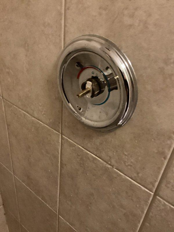 Responded to service call for upstairs hallway shower delivering only hot water and laundry room faucet producing hammering noise when turned on fully. Diagnosed faulty Moen 1222 cartridge in upstairs hallway bathroom shower valve preventing cold water flow. Removed defective cartridge and installed new replacement cartridge, restoring proper hot and cold water mixing function to shower. Investigated laundry room faucet water hammering issue and determined cold water supply angle stop valves were not fully open, restricting water flow and causing pressure surge noise. Opened angle stop valves completely, eliminating water hammering sound. All fixtures tested and confirmed operating properly upon completion.