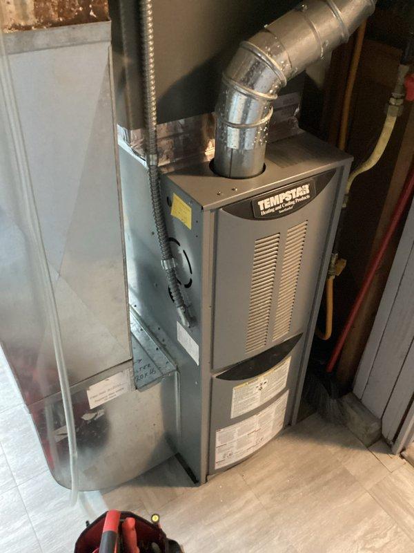 Responded to no-power call for residential furnace system. Upon arrival, confirmed complete loss of power to TempStar furnace unit. Performed electrical inspection of furnace control panel and associated electrical components mounted on wooden framing near HVAC installation. Identified electrical supply issue requiring specialist intervention and coordinated electrician dispatch to address power distribution problem affecting furnace operation.