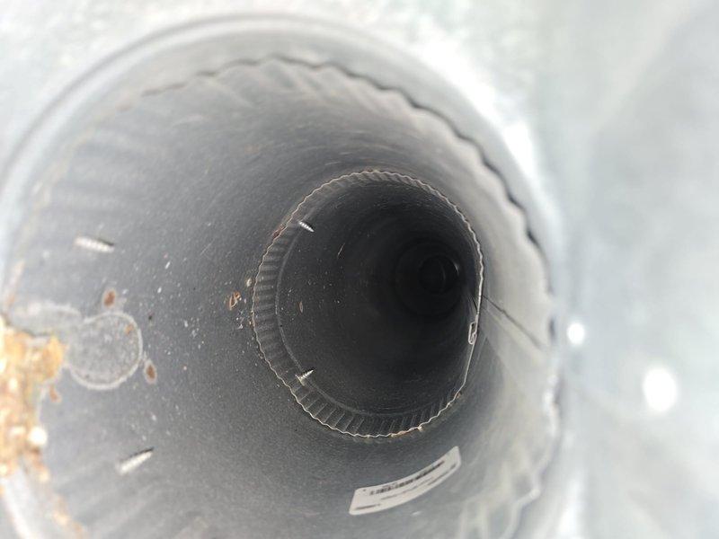 Completed comprehensive duct and dryer vent cleaning service addressing significant accumulation of dust and pet hair throughout the ventilation system. Thoroughly cleaned all accessible ductwork, removed debris buildup including visible rust-colored contamination and corrosion from interior duct surfaces, and cleaned all register vents to restore proper airflow and indoor air quality.