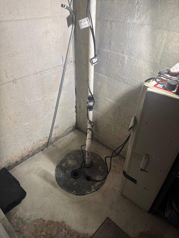 Responded to service call for non-operational sump pump in basement utility area. Upon inspection, determined existing sump pump had failed and required complete replacement. Removed failed pump unit from basin and installed new sump pump system, ensuring proper electrical connections and discharge piping. Verified pump operation and water level activation functioning correctly upon completion.