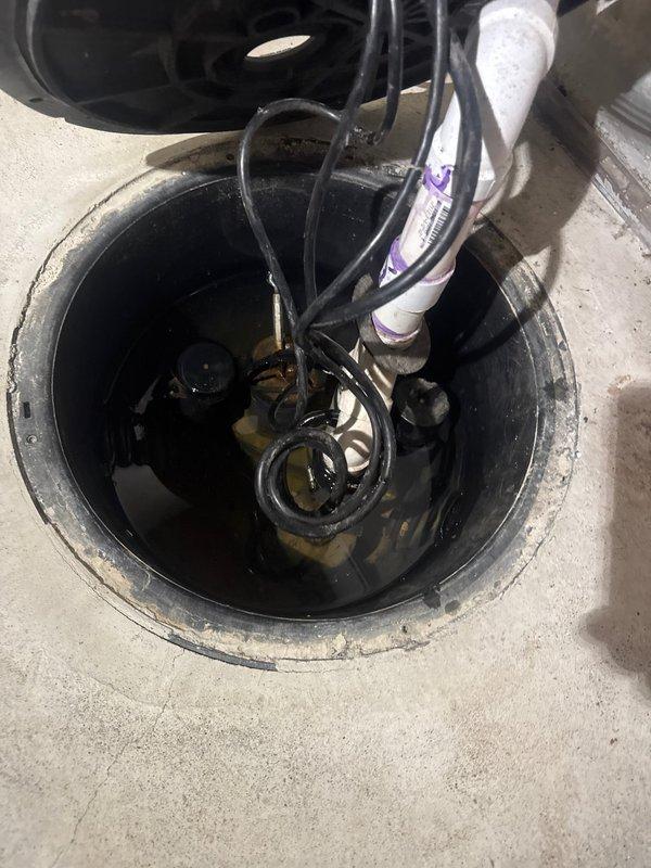 Responded to service call for non-operational sump pump in basement utility area. Upon inspection, determined existing sump pump had failed and required complete replacement. Removed failed pump unit from basin and installed new sump pump system, ensuring proper electrical connections and discharge piping. Verified pump operation and water level activation functioning correctly upon completion.