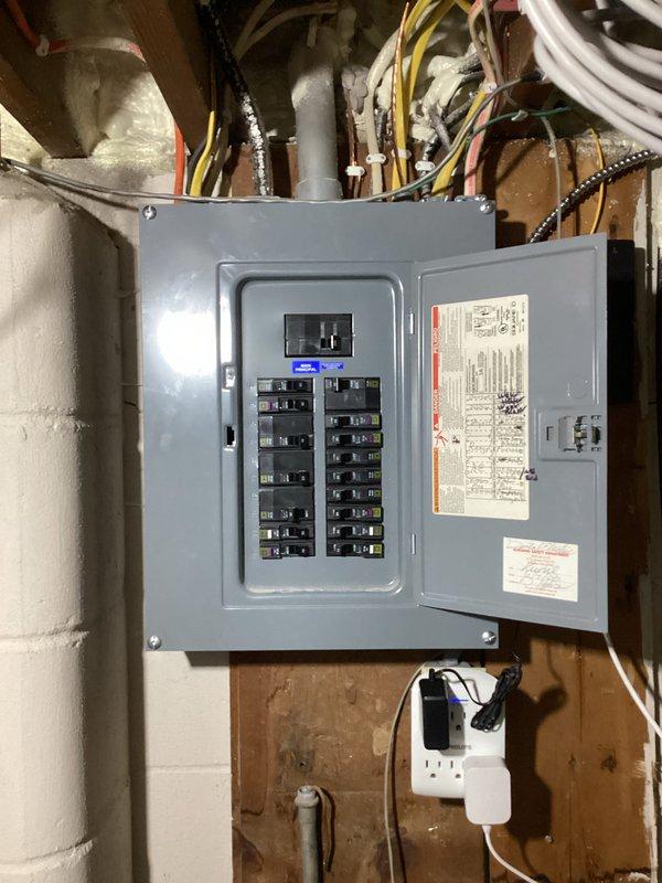 Responded to customer concerns regarding intermittent light flickering and periodic power surges in residence with older electrical wiring. Upon inspection, determined that flickering occurred during high power draw events, which is within normal operating parameters for the existing electrical system. Performed comprehensive inspection of main electrical panel, systematically tightening all breaker connections and terminal points to ensure proper electrical contact and reduce potential arcing. Verified panel integrity and proper wire routing throughout service.