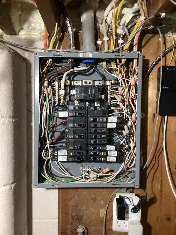 Responded to customer concerns regarding intermittent light flickering and periodic power surges in residence with older electrical wiring. Upon inspection, determined that flickering occurred during high power draw events, which is within normal operating parameters for the existing electrical system. Performed comprehensive inspection of main electrical panel, systematically tightening all breaker connections and terminal points to ensure proper electrical contact and reduce potential arcing. Verified panel integrity and proper wire routing throughout service.