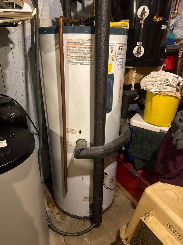 Responded to service call regarding odor emanating from hot water supply. Upon inspection of the 2019-installed gas water heater, confirmed the source of smell was a deteriorated anode rod. Replaced the sacrificial anode rod to eliminate sulfur bacteria buildup causing the unpleasant odor when hot water was used. Verified proper operation of pressure relief valve and inspected all plumbing connections at tank top. System tested and confirmed odor issue resolved following anode rod replacement.