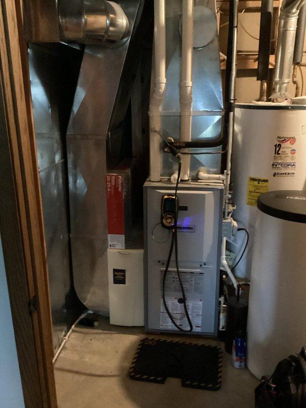 Responded to service call for furnace experiencing rapid short cycling. Upon arrival, inspected 18-year-old heating system and performed diagnostic testing to identify intermittent operational issues. Determined root cause to be contaminated flame sensor preventing proper flame detection and causing safety lockouts. Removed and thoroughly cleaned flame sensor rod to restore proper conductivity. Tested system operation through multiple heating cycles to verify proper ignition sequence, flame sensing, and burner operation. Used digital multimeter to confirm electrical readings within manufacturer specifications. System now operating normally with stable flame detection and proper cycling behavior.