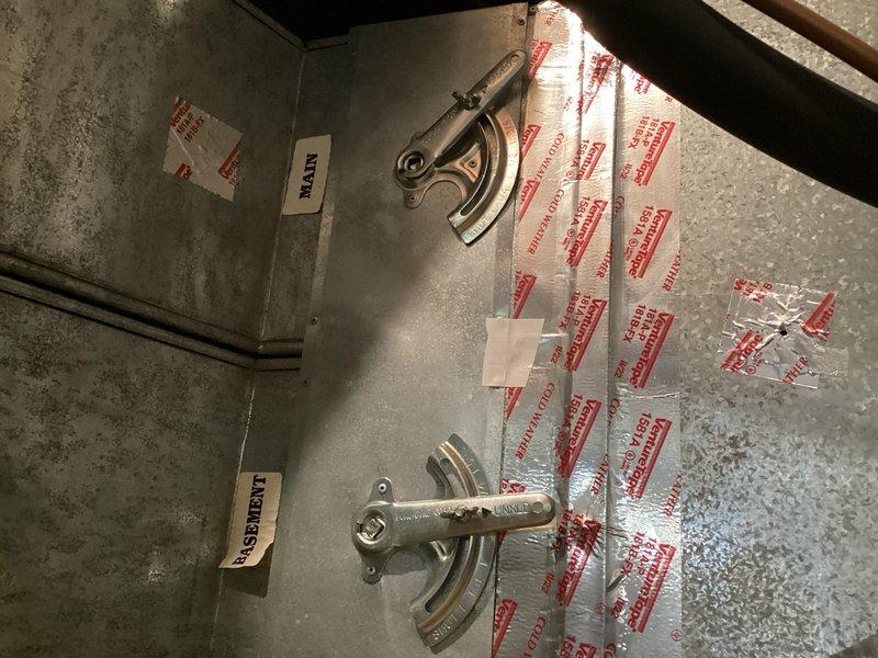 Responded to service call for dry bearing sound occurring at furnace startup. Upon inspection, identified damaged manual baffle in main floor duct causing swaying motion and squeaking noise during operation. Removed defective manual baffle from main floor ductwork to eliminate noise issue.