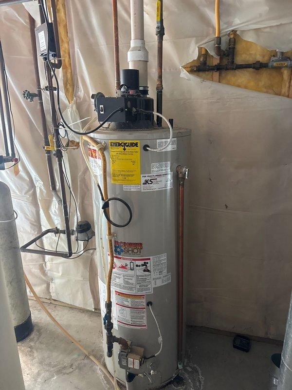 Arrived on-site to provide estimate for existing tanked water heater replacement and additional plumbing repairs. Current water heater remains operational but is aged and nearing end of service life. Assessed outdoor spigot replacements and repairs, noting frost-free units may require internal component replacement. Evaluated installation requirements for new shut-off valve. Documented existing water heater installation with photographs showing current condition, pipe connections, gas lines, and utility room configuration for future reference and estimate preparation.