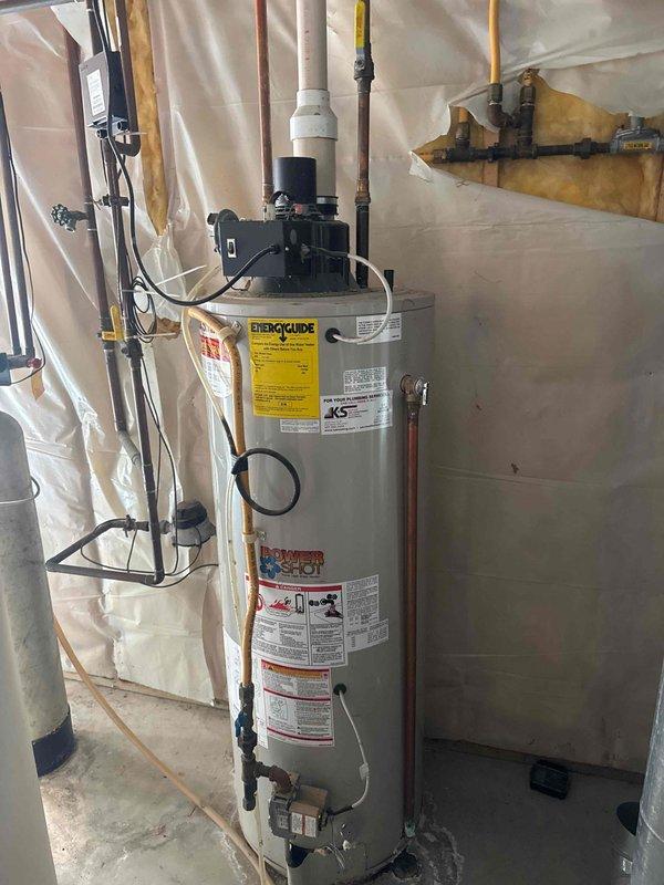 Arrived on-site to provide estimate for existing tanked water heater replacement and additional plumbing repairs. Current water heater remains operational but is aged and nearing end of service life. Assessed outdoor spigot replacements and repairs, noting frost-free units may require internal component replacement. Evaluated installation requirements for new shut-off valve. Documented existing water heater installation with photographs showing current condition, pipe connections, gas lines, and utility room configuration for future reference and estimate preparation.