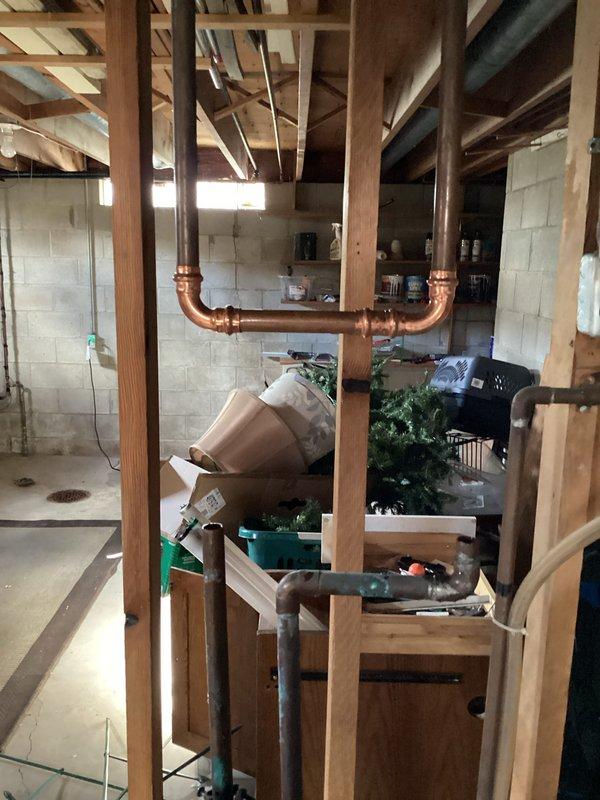 Responded to low water pressure issue affecting half of the residence. Upon investigation, identified malfunctioning water softener as the source of supply restriction. Bypassed the existing water softener system using copper piping to restore full water pressure throughout the home. Documented current plumbing configuration and provided estimate for complete water softener system replacement.