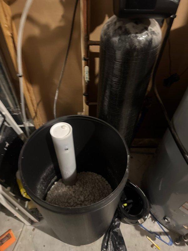 Responded to water leak complaint with unknown source. Upon inspection, identified water softener system running constantly due to failed stack gasket. Removed defective gasket, installed replacement component, and tested system to confirm proper cycling and operation. Leak resolved and system restored to normal function.