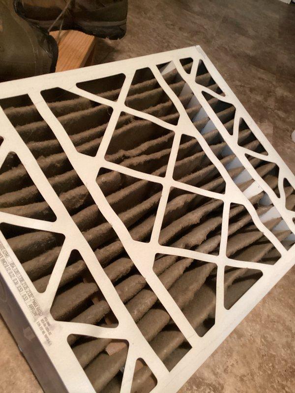 Responded to no heat call for propane furnace running continuously but blowing cold air. Upon inspection, found heavily soiled air filter restricting airflow and faulty gas valve displaying E3 error code on control board. Replaced dirty filter and defective gas valve, restoring proper heating operation to system.