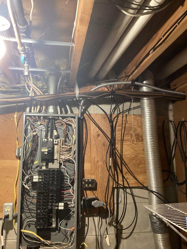 Conducted on-site assessment for hot tub electrical installation in basement utility area. Evaluated existing electrical panel capacity and circuit breaker configuration to determine feasibility of extending dedicated circuit to future hot tub location. Inspected current electrical infrastructure, including panel load capacity, available breaker slots, and wire routing pathways through exposed framing. Provided detailed estimate for installation of new outlet at designated hot tub location, pending delivery and final placement of unit.