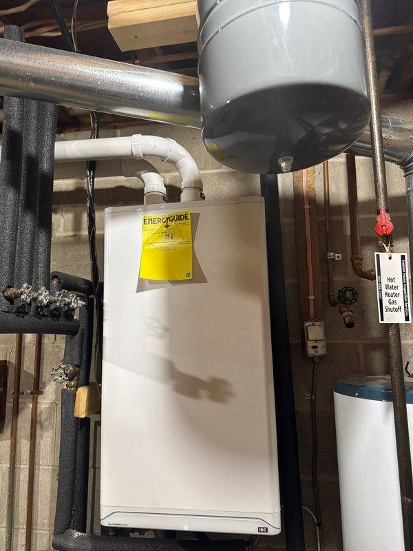 Responded to service call for water softener backwashing into utility sink with strong metallic odor. Upon inspection, determined the water softener system had failed and was discharging improperly. Recommended and scheduled unit replacement due to system failure beyond repair.